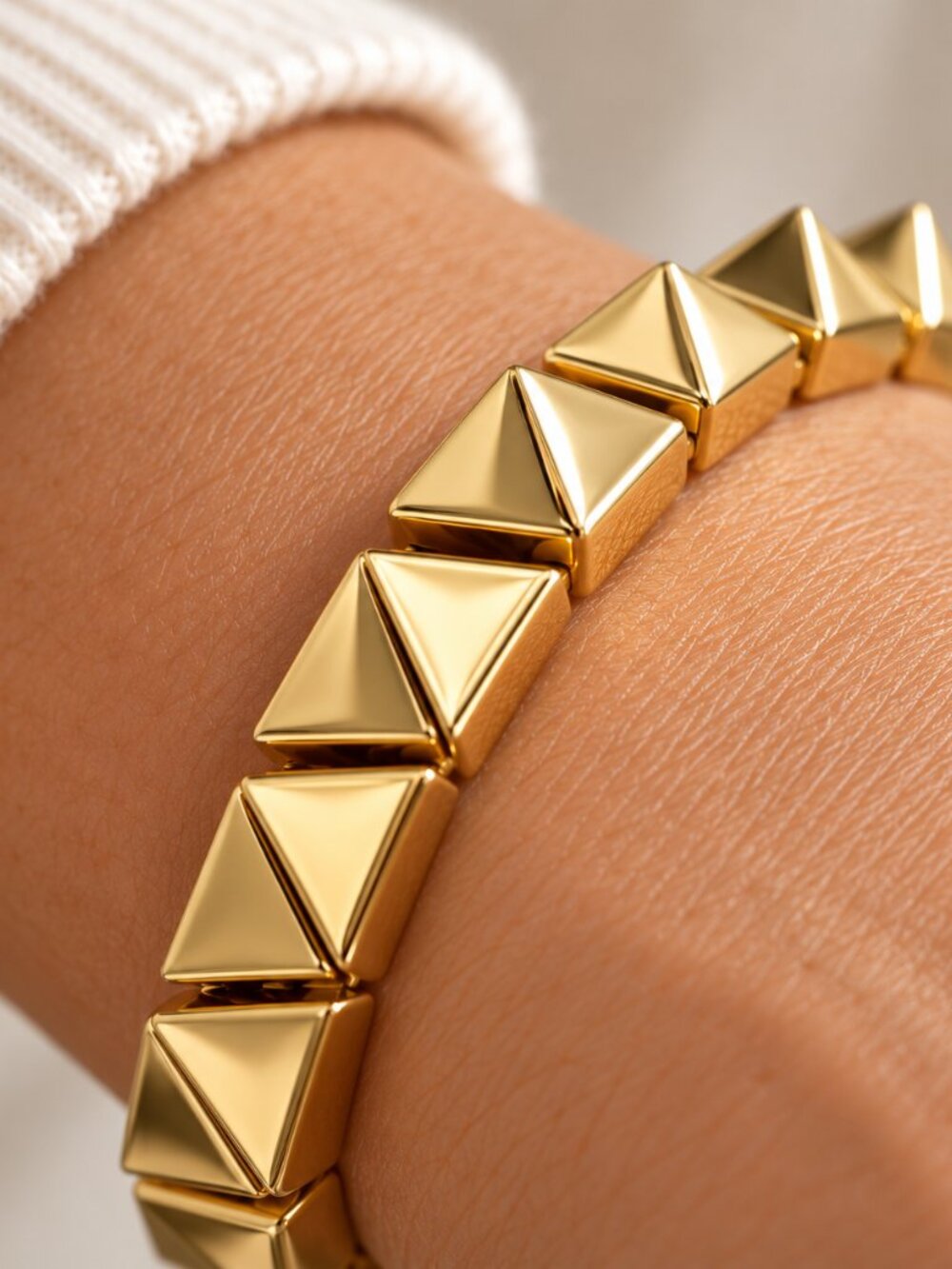 nOir Gold Tone Pyramid Stud Link Bracelet 7"